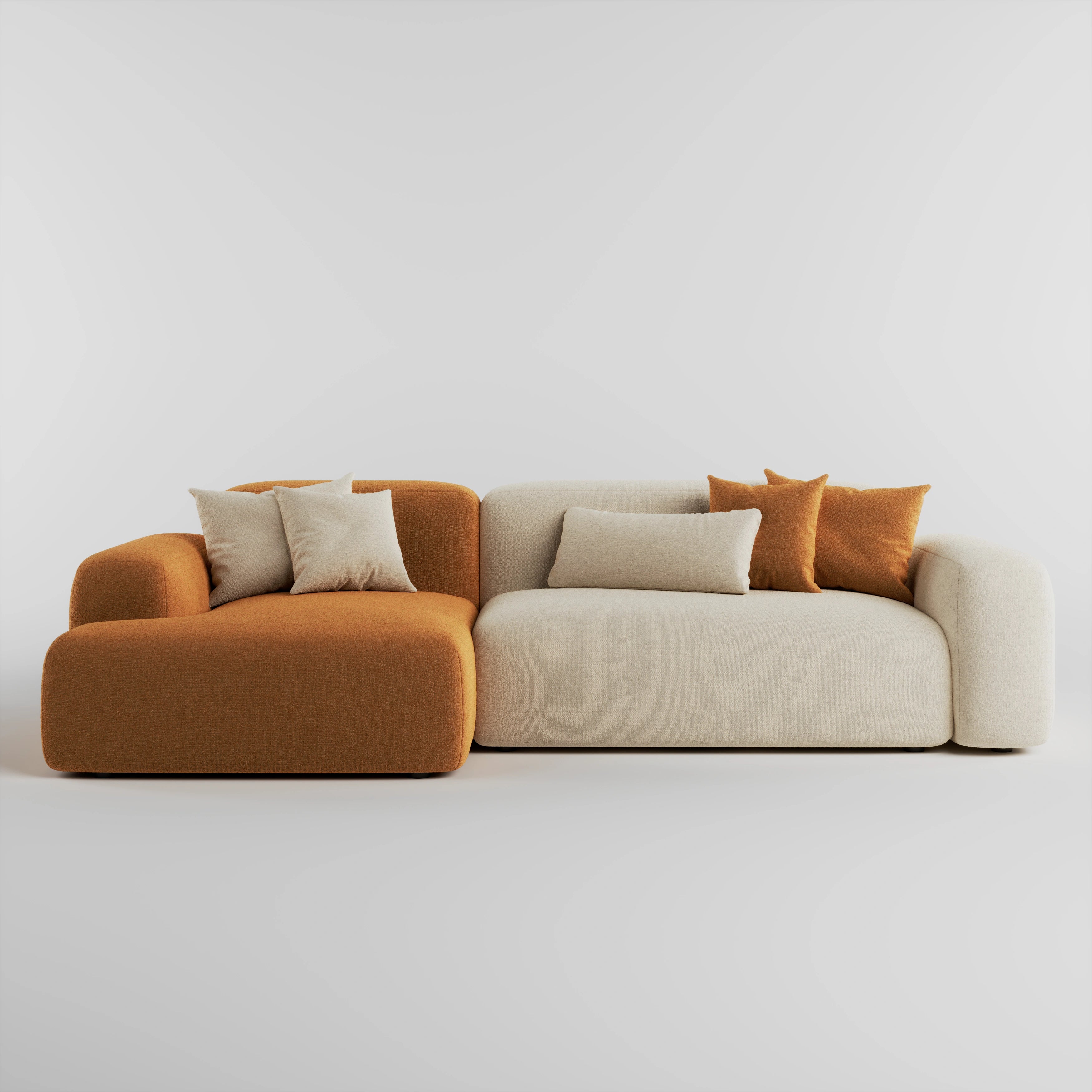 Two-toned sofa with orange and beige sections on a white background