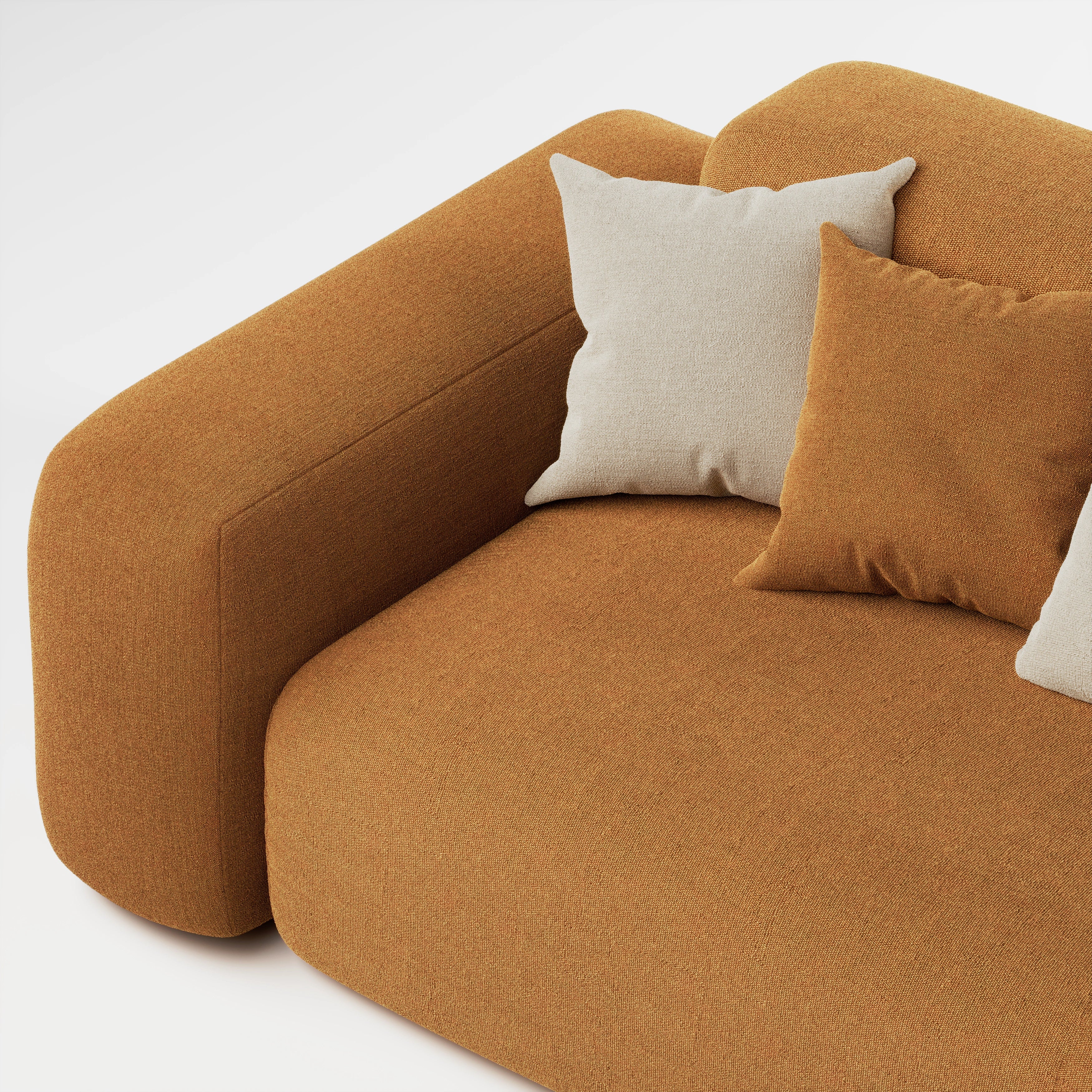Close up of Cove 3 seater sofa in caramel fabric showing opposite armrest, seat, and cushions